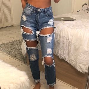 Very distressed high waisted denim jeans